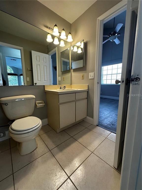 652 Roaring Drive, Unit 234 Altamonte Springs, FL 32714 - Photo 25 of 39 a bathroom with a toilet sink and mirror