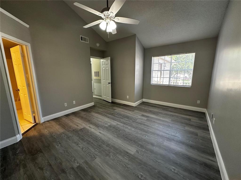 652 Roaring Drive, Unit 234 Altamonte Springs, FL 32714 - Photo 31 of 39 a view of livingroom with window ceiling fan and hardwood floor