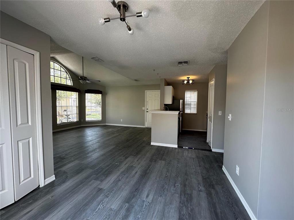 652 Roaring Drive, Unit 234 Altamonte Springs, FL 32714 - Photo 34 of 39 a view of a living room with wooden floor and a window
