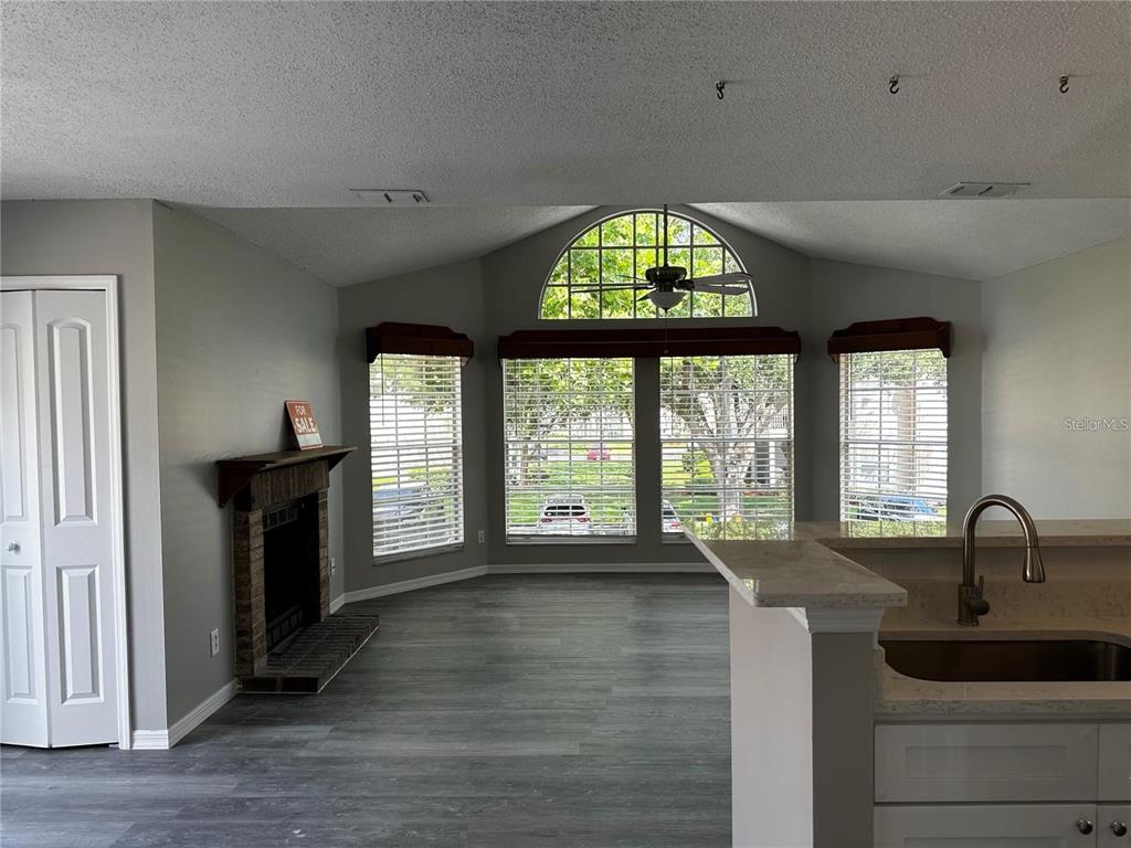 652 Roaring Drive, Unit 234 Altamonte Springs, FL 32714 - Photo 5 of 39 a living room with furniture and a large window