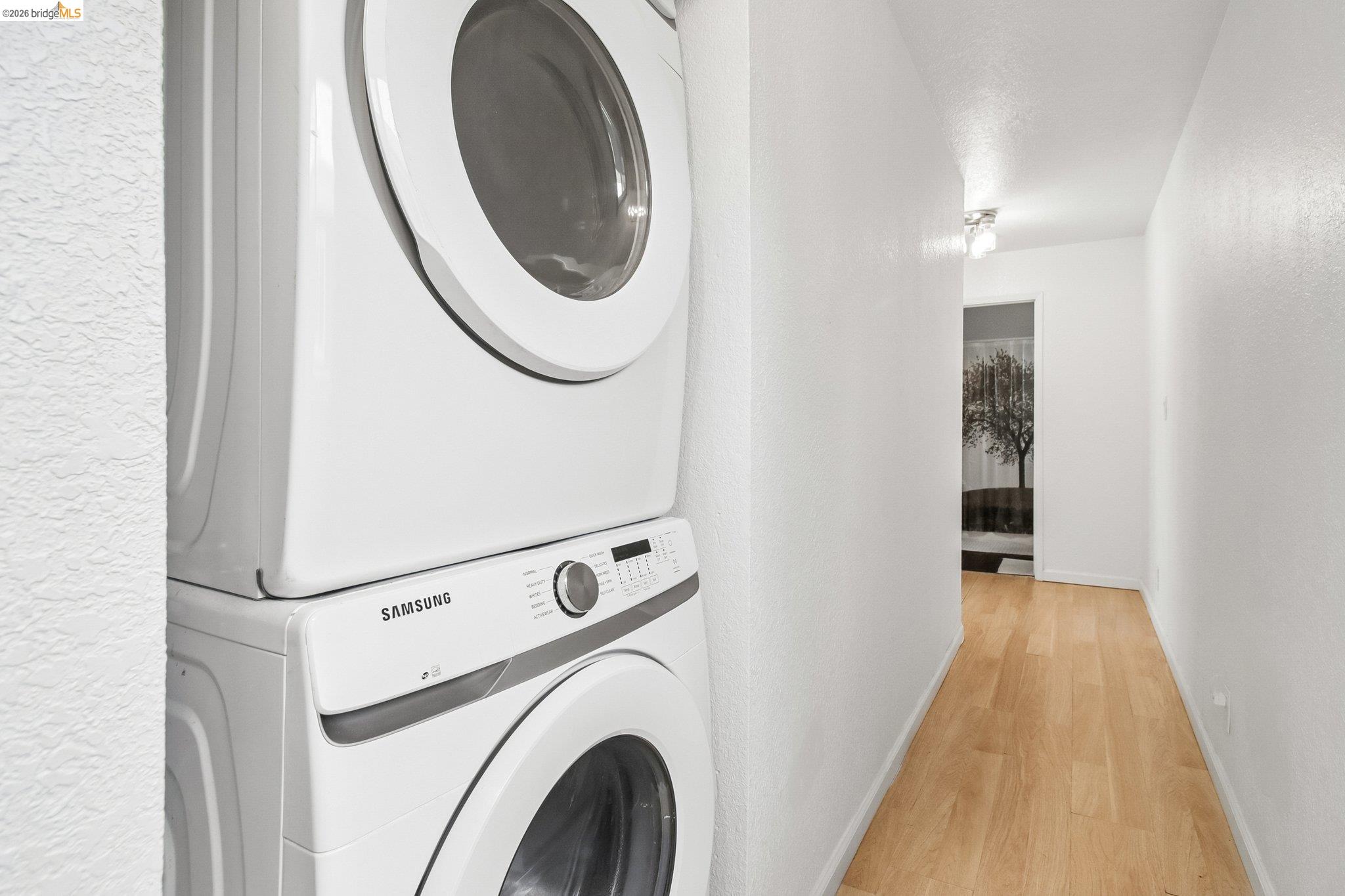 874 Pine Street Oakland, CA 94607 - Photo 17 of 39 Dedicated laundry area featuring a stacked washer and dryer