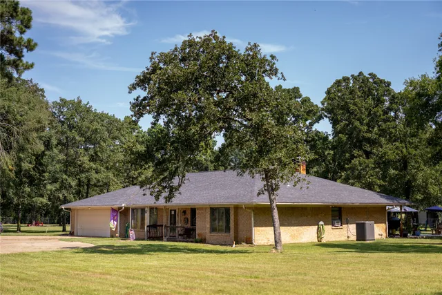 a front view of a house with swimming pool