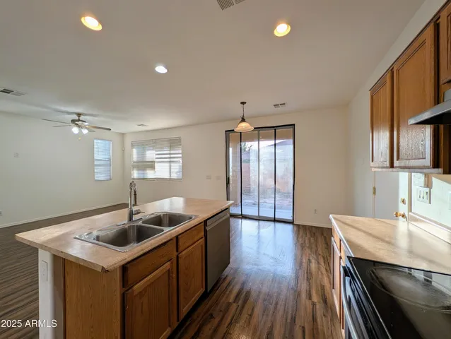 a kitchen with a stove a sink and a microwave