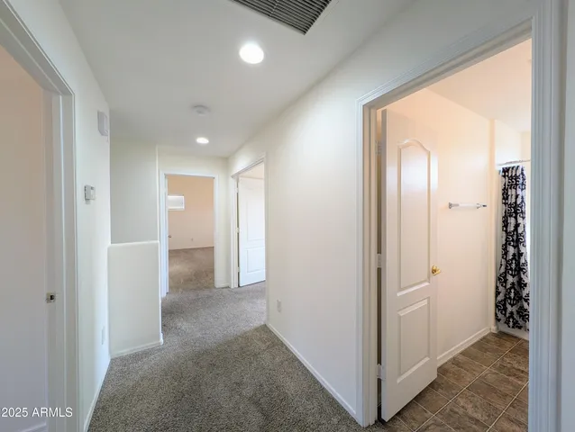a view of a livingroom with a ceiling fan and window