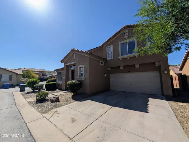 a view of a house with sitting area and furniture
