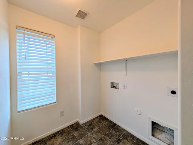 a view of a barn in the middle of a yard