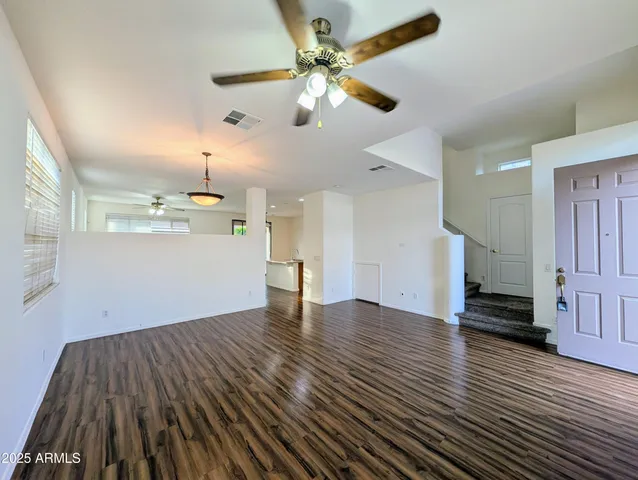 a kitchen with a sink stove and wooden cabinets
