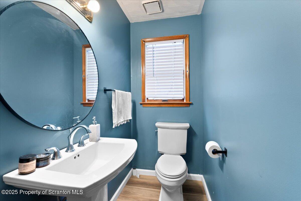 211 New Street Duryea, PA 18642 - Photo 12 of 32 a bathroom with a sink toilet and mirror
