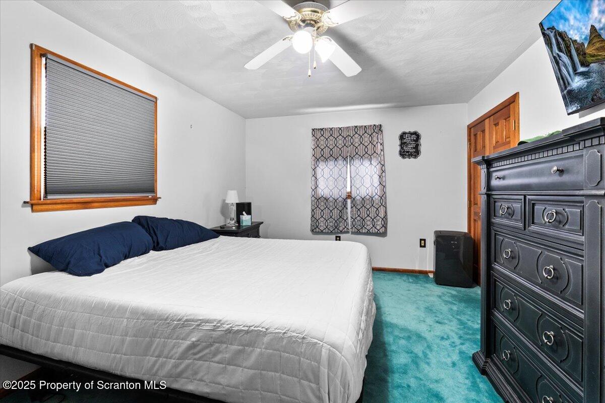 211 New Street Duryea, PA 18642 - Photo 13 of 32 a bedroom with a bed dresser and a window