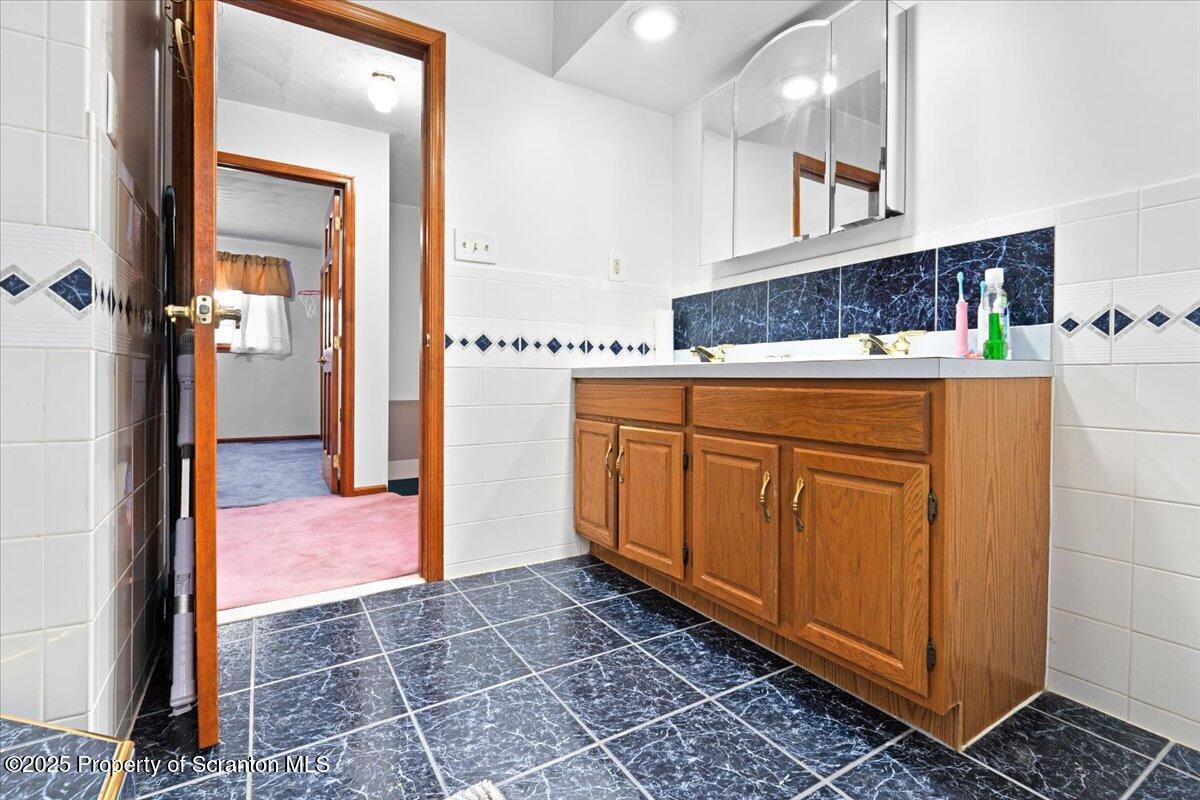 211 New Street Duryea, PA 18642 - Photo 21 of 32 a kitchen with a refrigerator and a sink