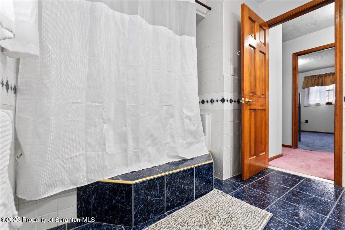 211 New Street Duryea, PA 18642 - Photo 22 of 32 a bathroom with a sink and a shower