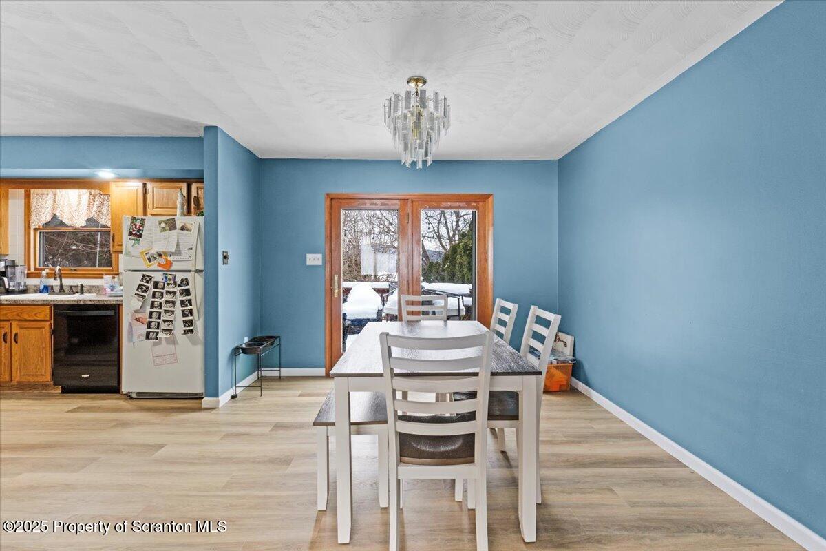 211 New Street Duryea, PA 18642 - Photo 6 of 32 a view of a dining room with furniture wooden floor and chandelier