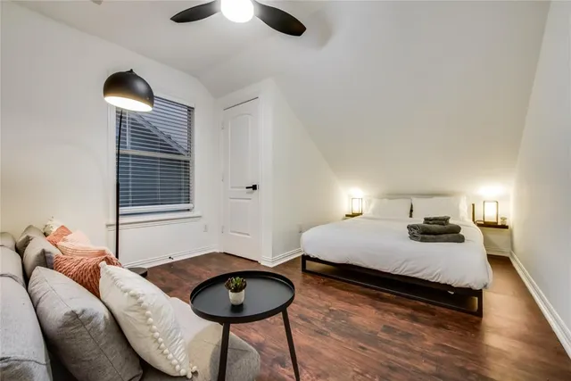 a bedroom with furniture and a wooden floor