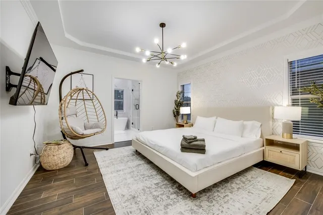 a living room with furniture a table and a rug