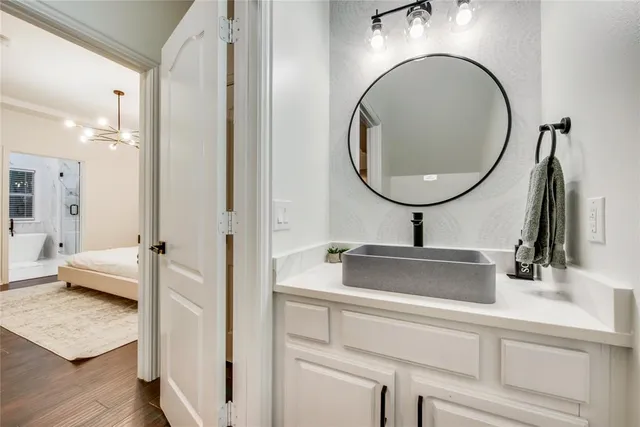 a bathroom with a sink and a mirror