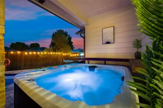 a view of a pool in the backyard