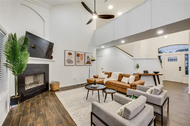 a living room with furniture and a fireplace