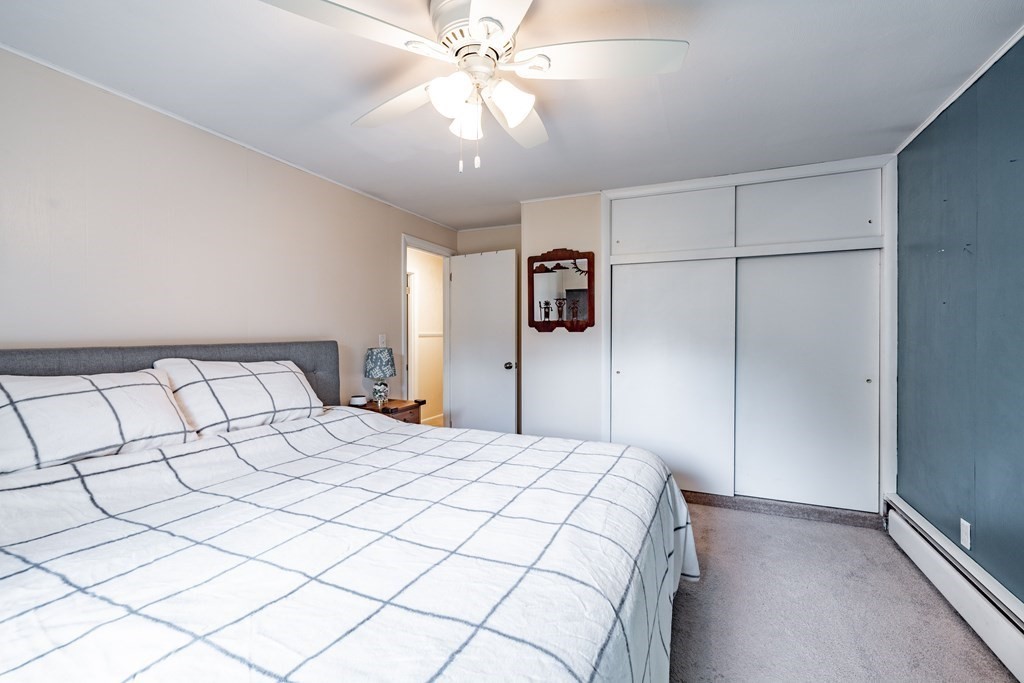 83 Mallowhill Road Springfield, MA 01129 - Photo 16 of 38 a bedroom with a bed and a ceiling fan