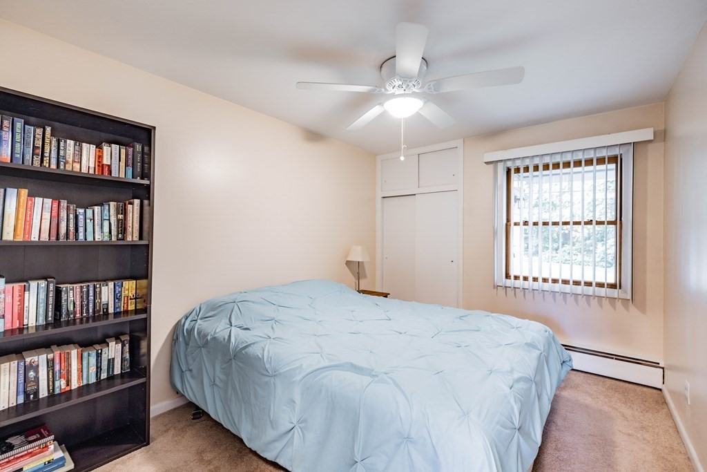 83 Mallowhill Road Springfield, MA 01129 - Photo 24 of 38 a bedroom with a large bed and a book shelf