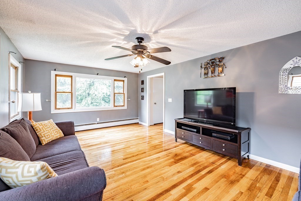83 Mallowhill Road Springfield, MA 01129 - Photo 4 of 38 a living room with furniture and a flat screen tv