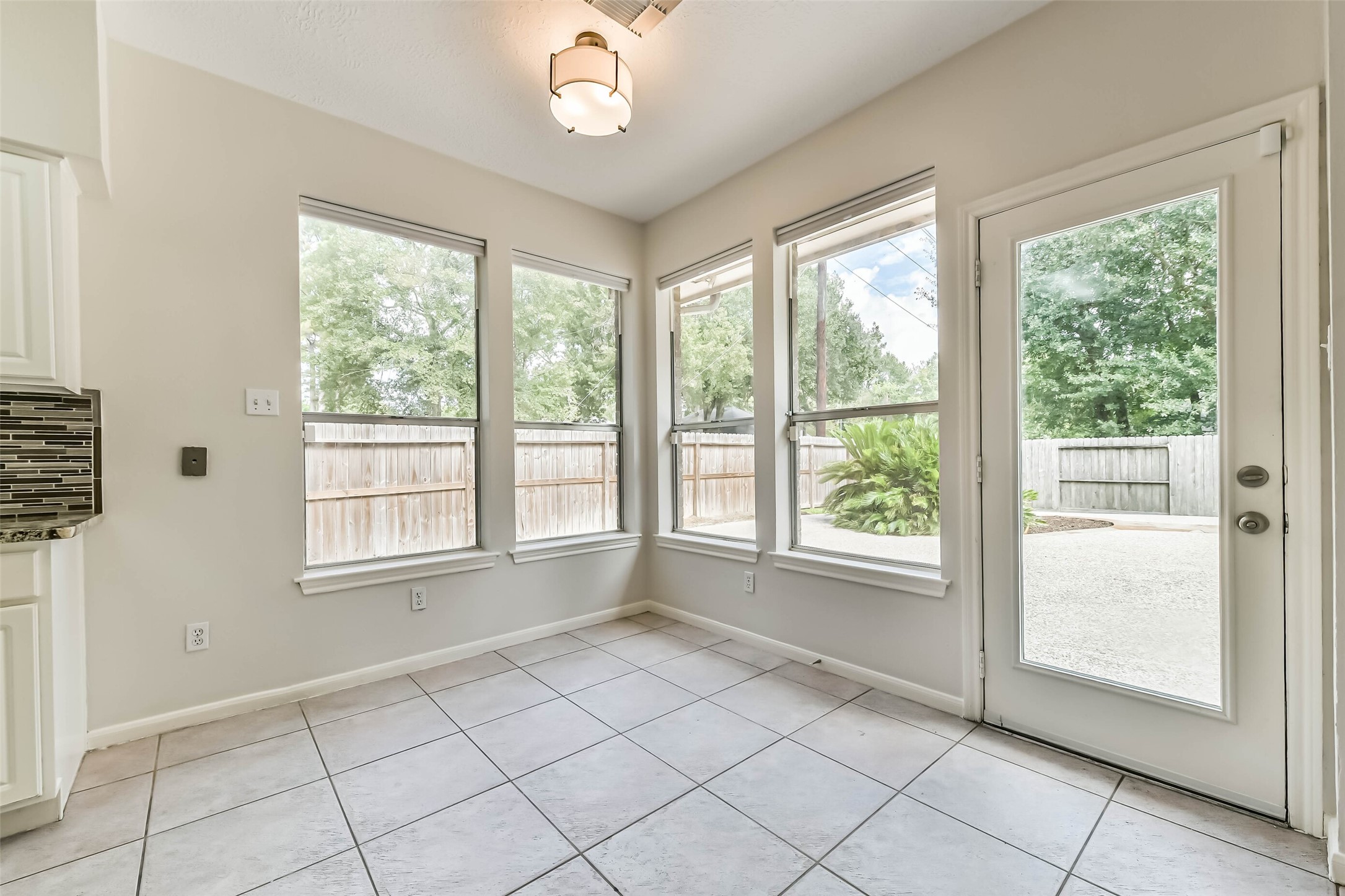 6338 Maple Spring Place Humble, TX 77346 - Photo 16 of 50 A sunny spot for your first cup of coffee, a leisurely brunch or a quiet moment with a book. Windows wrap the breakfast nook in natural light, and direct patio access lets you carry the morning outdoors.