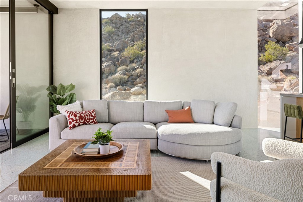 1824 Mountain Shadow Road Joshua Tree, CA 92252 - Photo 13 of 39 a living room with furniture and a potted plant