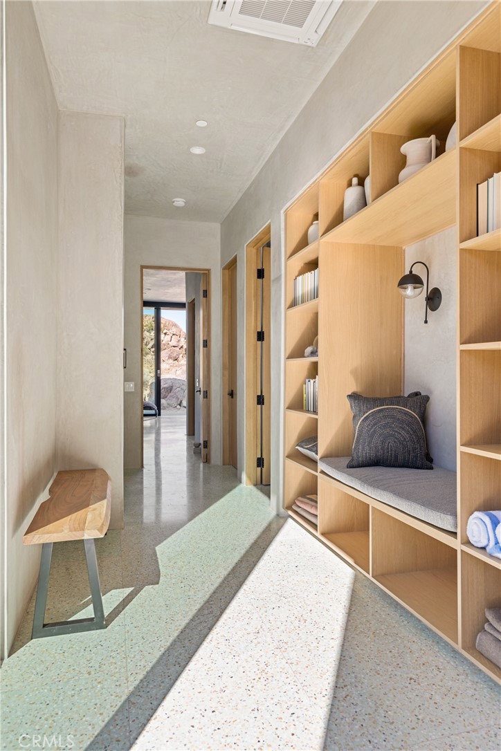 1824 Mountain Shadow Road Joshua Tree, CA 92252 - Photo 21 of 39 a living room with furniture and a rug