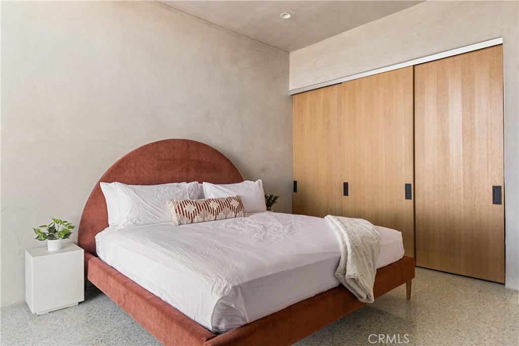 1824 Mountain Shadow Road Joshua Tree, CA 92252 - Photo 24 of 39 a bedroom with a bed and a window