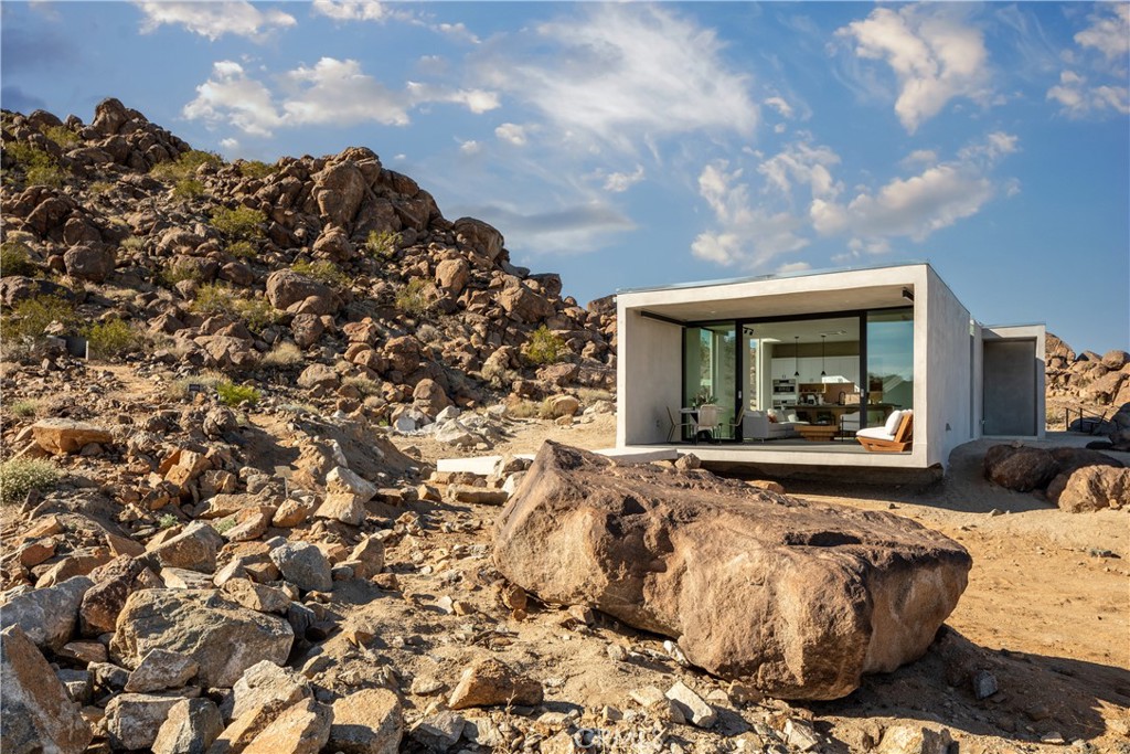 1824 Mountain Shadow Road Joshua Tree, CA 92252 - Photo 28 of 39 a view of a two couches in the patio