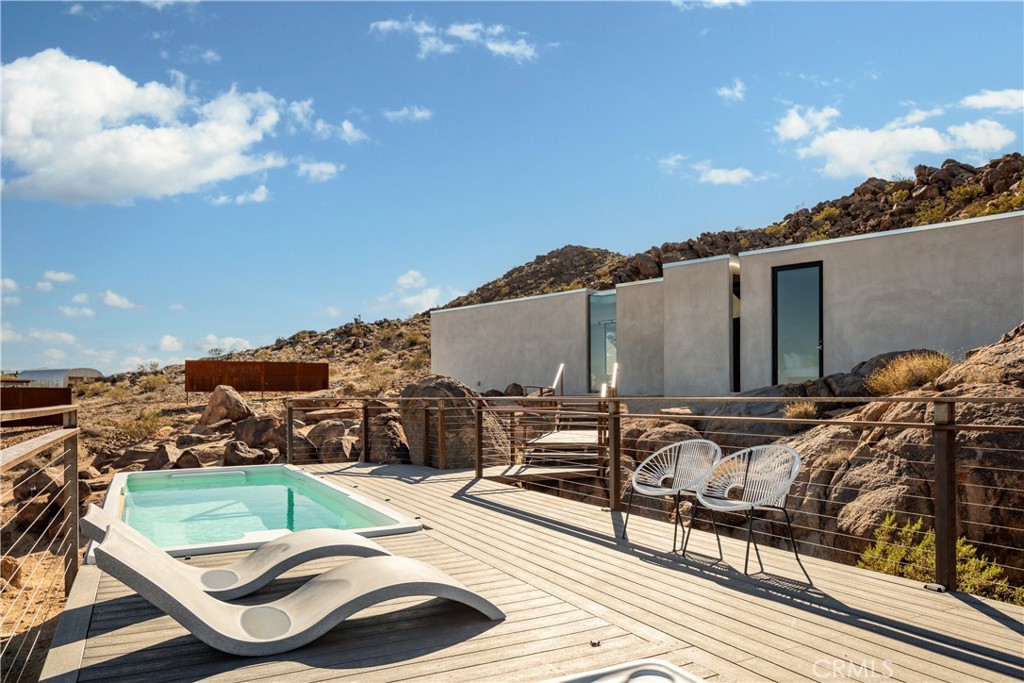 1824 Mountain Shadow Road Joshua Tree, CA 92252 - Photo 30 of 39 a view of a terrace with furniture