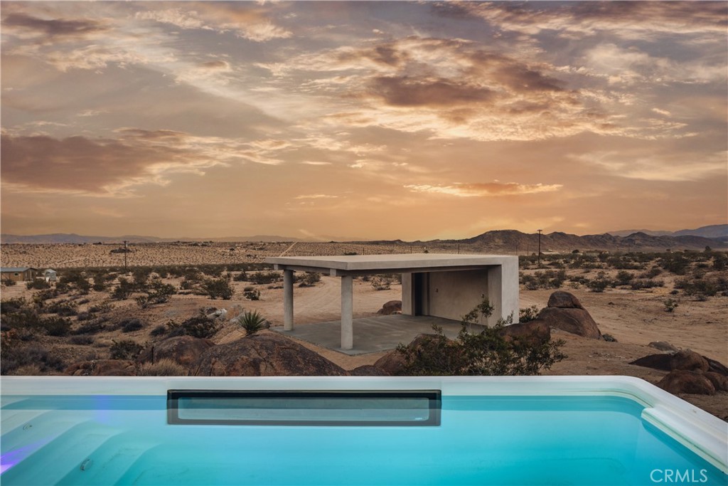 1824 Mountain Shadow Road Joshua Tree, CA 92252 - Photo 32 of 39 a view of a swimming pool with a terrace