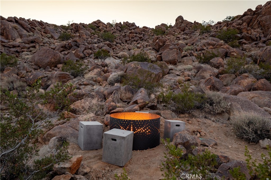 1824 Mountain Shadow Road Joshua Tree, CA 92252 - Photo 33 of 39 a view of a outdoor space with a swimming pool and outdoor seating