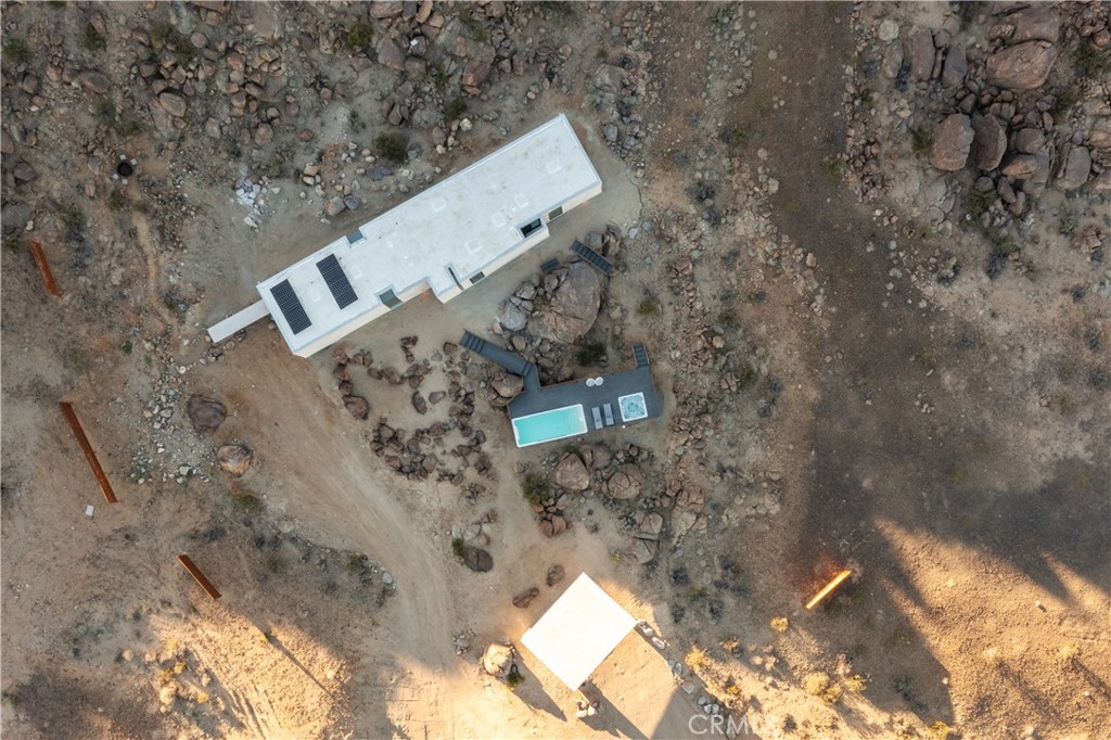1824 Mountain Shadow Road Joshua Tree, CA 92252 - Photo 36 of 39 a aerial view of a house with a yard