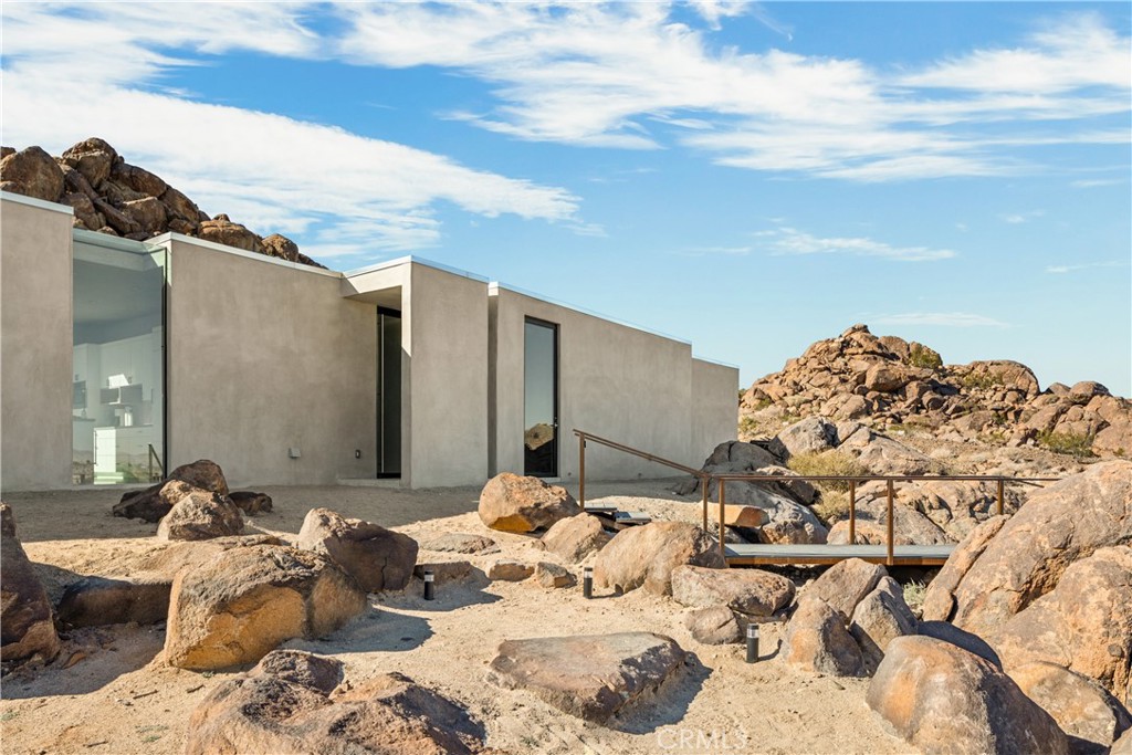 1824 Mountain Shadow Road Joshua Tree, CA 92252 - Photo 5 of 39 a view of a balcony with couches and sky view