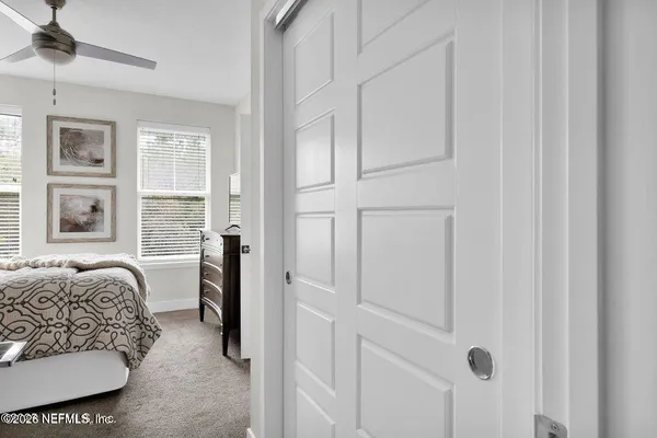 a bedroom with furniture and a window