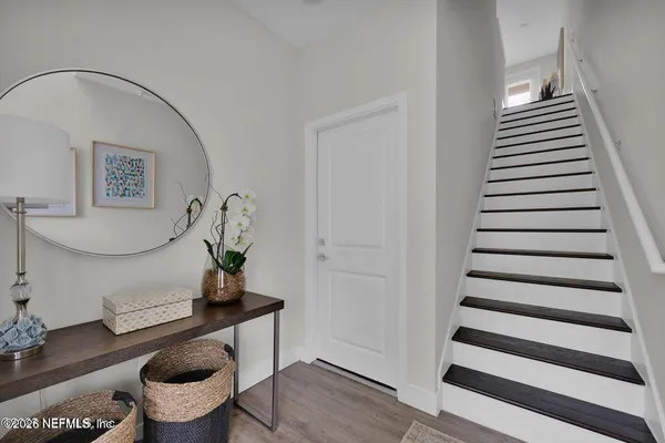 a view of entryway with wooden floor