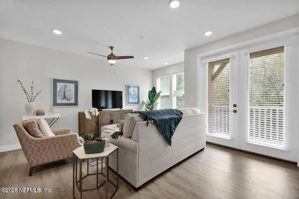 a living room with furniture and a large window