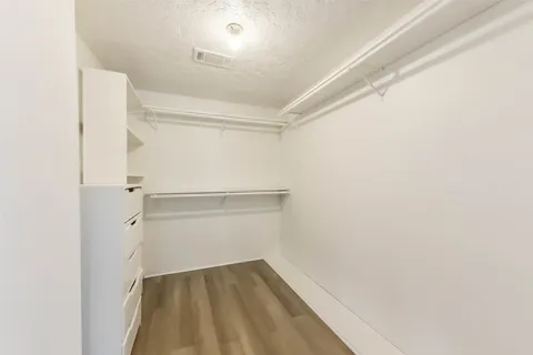 a view of an empty walk in closet