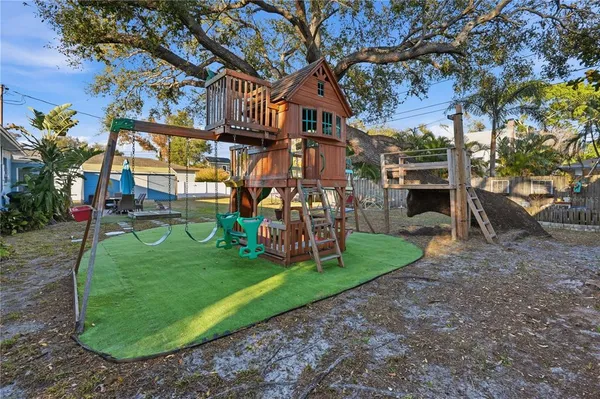 a view of a park with swings and slides