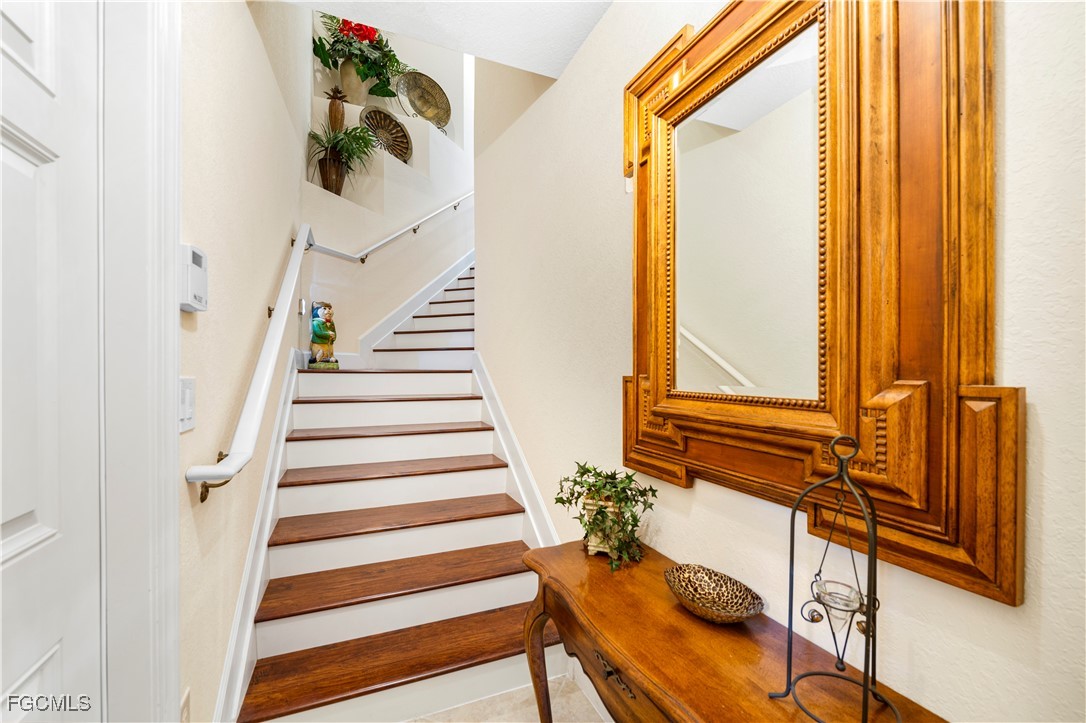 12930 New Market Street, Unit 202 Fort Myers, FL 33913 - Photo 3 of 30 a view of entryway and hall with wooden floor