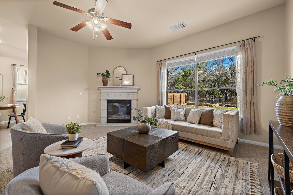 3948 Sapphire Loop Round Rock, TX 78681 - Photo 14 of 40 a living room with furniture and a fireplace