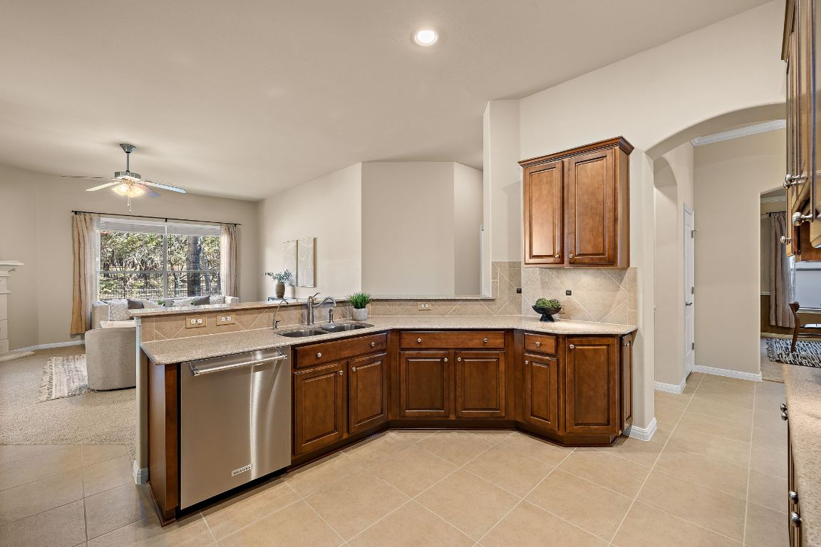 3948 Sapphire Loop Round Rock, TX 78681 - Photo 20 of 40 a kitchen with a sink stove and cabinets