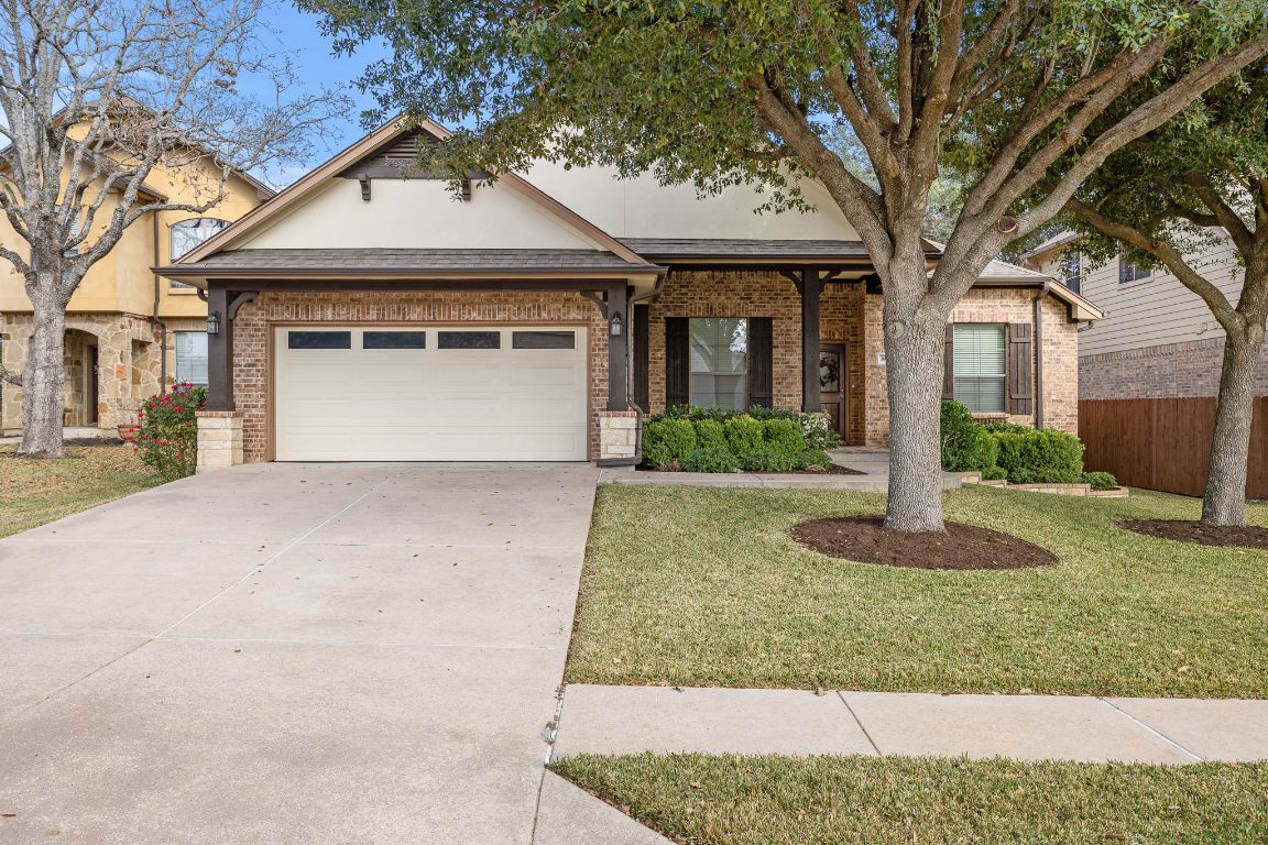 3948 Sapphire Loop Round Rock, TX 78681 - Photo 2 of 40 a front view of a house with a yard and garage