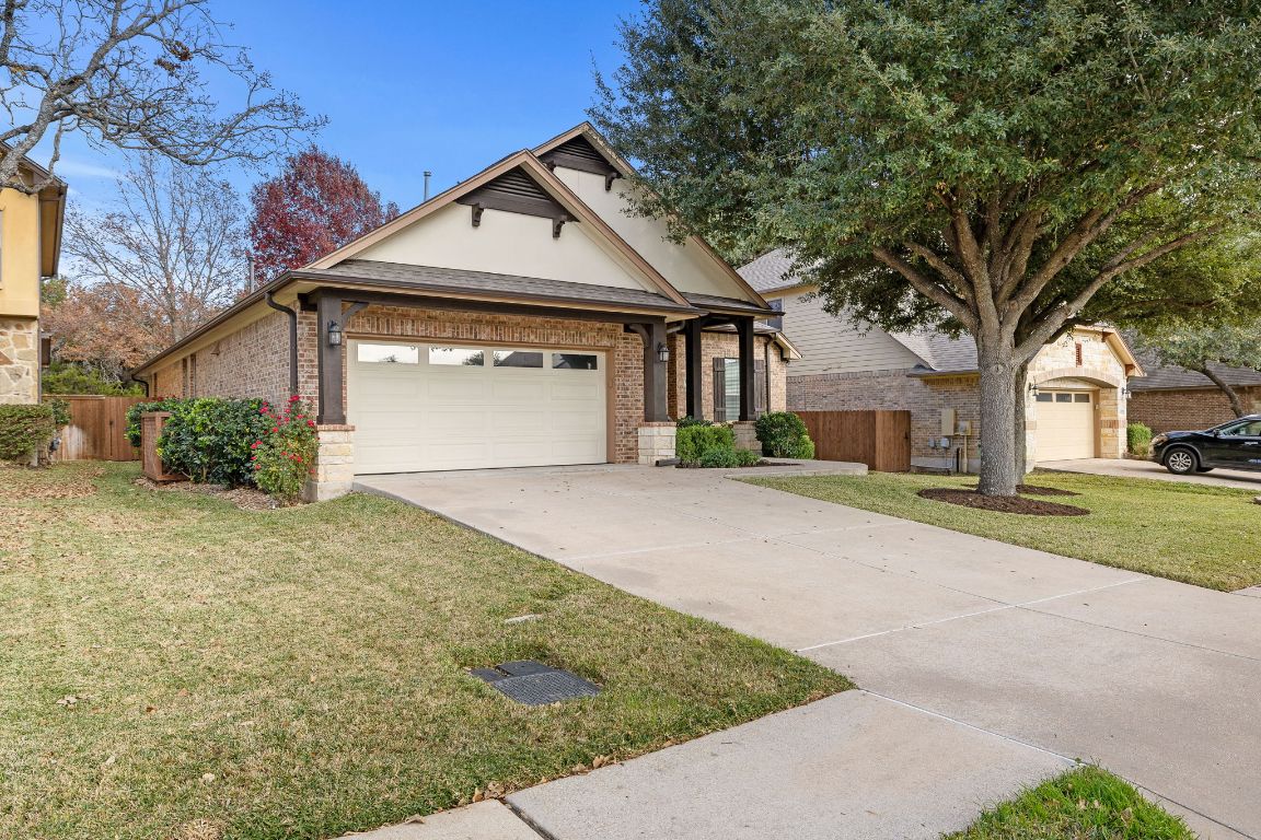 3948 Sapphire Loop Round Rock, TX 78681 - Photo 3 of 40 a front view of a house with a yard and garage