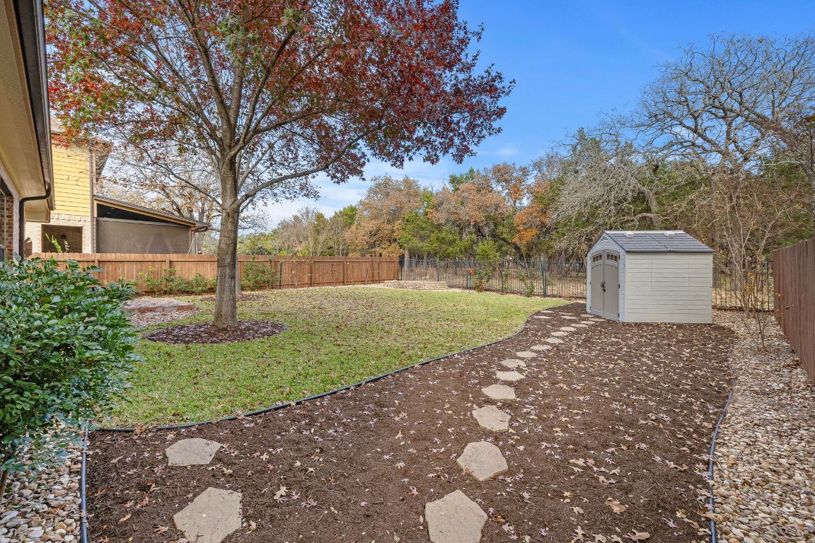 3948 Sapphire Loop Round Rock, TX 78681 - Photo 35 of 40 a backyard of a house with lots of green space