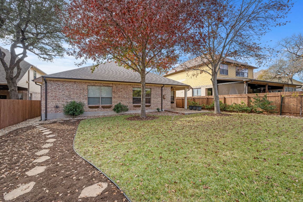 3948 Sapphire Loop Round Rock, TX 78681 - Photo 36 of 40 a front view of a house with a yard