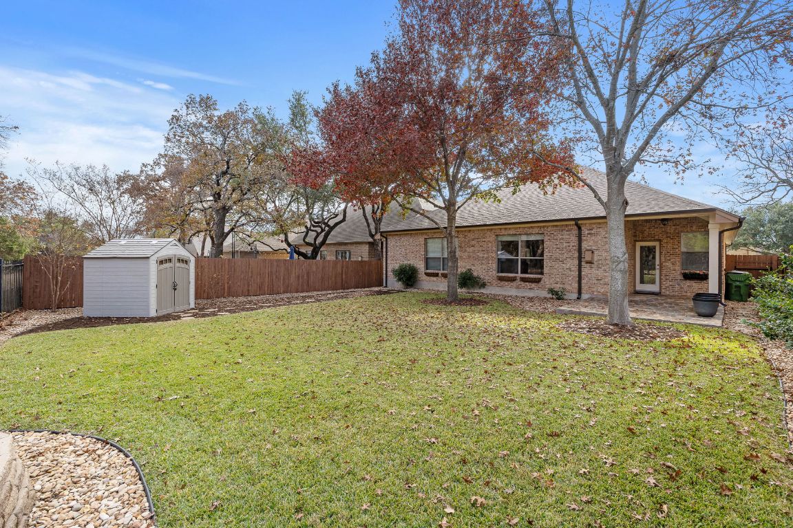 3948 Sapphire Loop Round Rock, TX 78681 - Photo 37 of 40 a front view of a house with garden