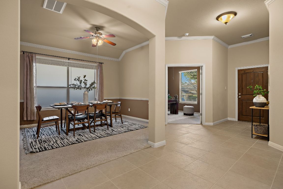 3948 Sapphire Loop Round Rock, TX 78681 - Photo 7 of 40 a view of a dining room with furniture and chandelier