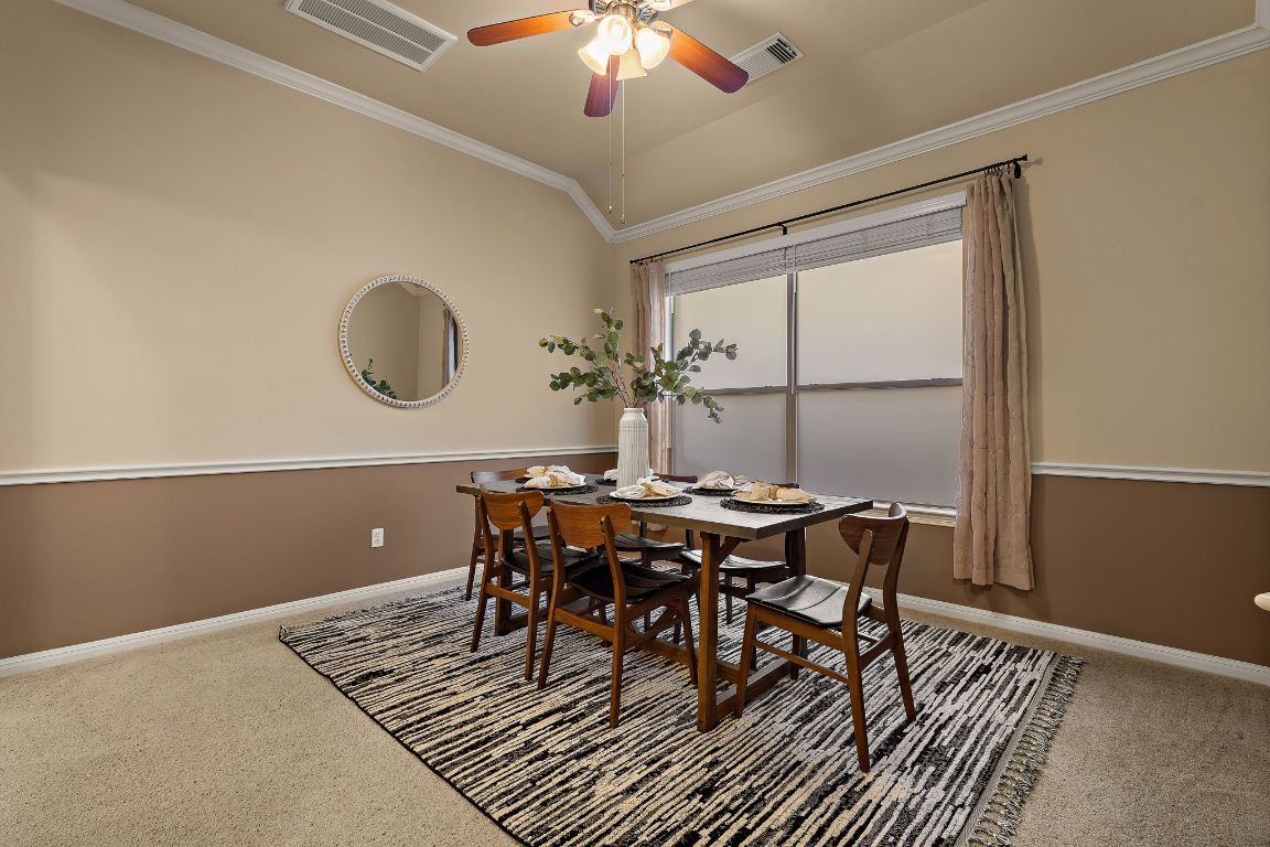 3948 Sapphire Loop Round Rock, TX 78681 - Photo 9 of 40 a view of a dining room with furniture and chandelier