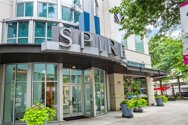 a view of a house with potted plants